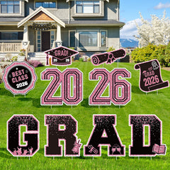 KLYRO front display yard signs showing bold pink 2026 and GRAD for curbside celebration