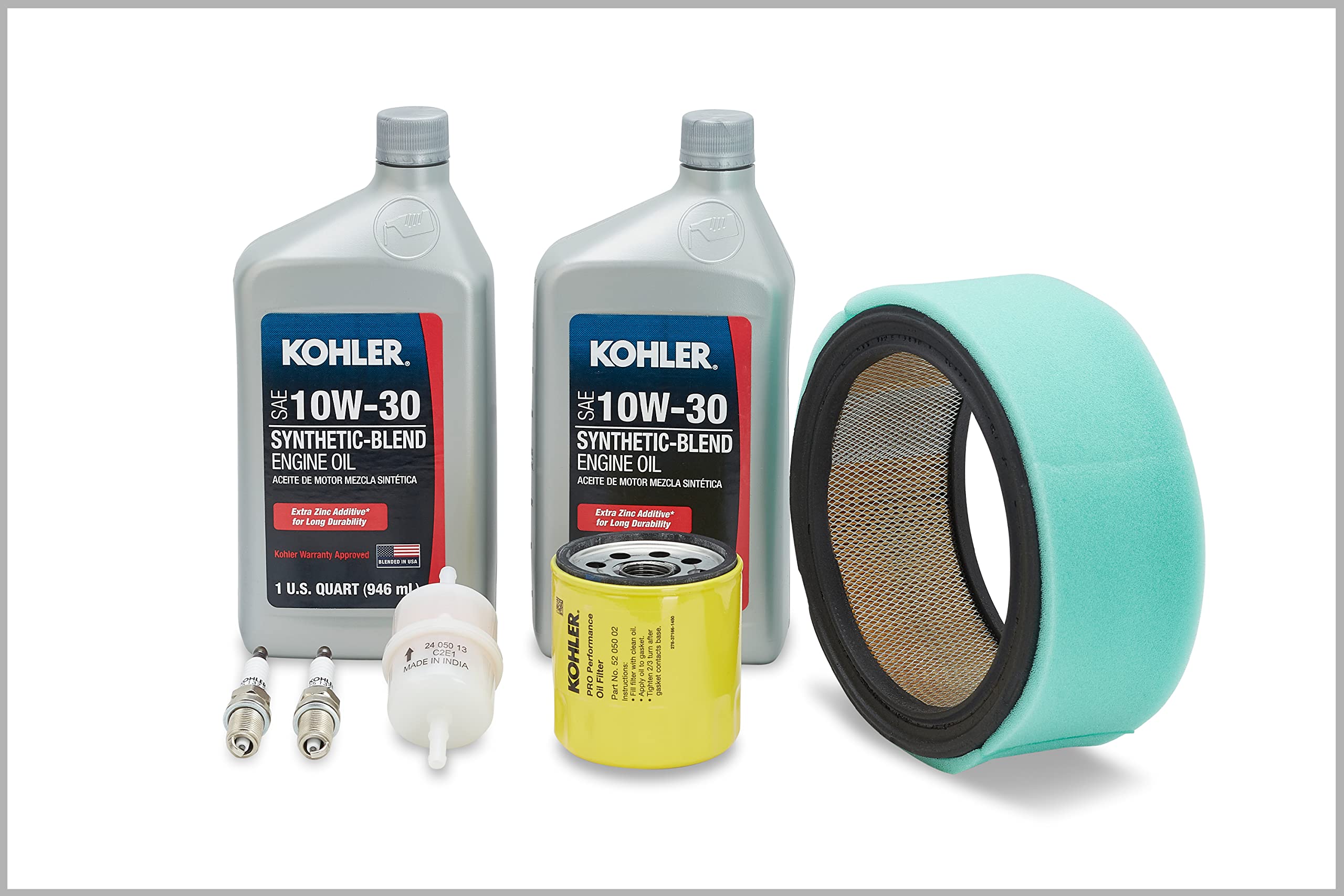 Kohler kit contents laid out to display filters, oil, plugs for faster service