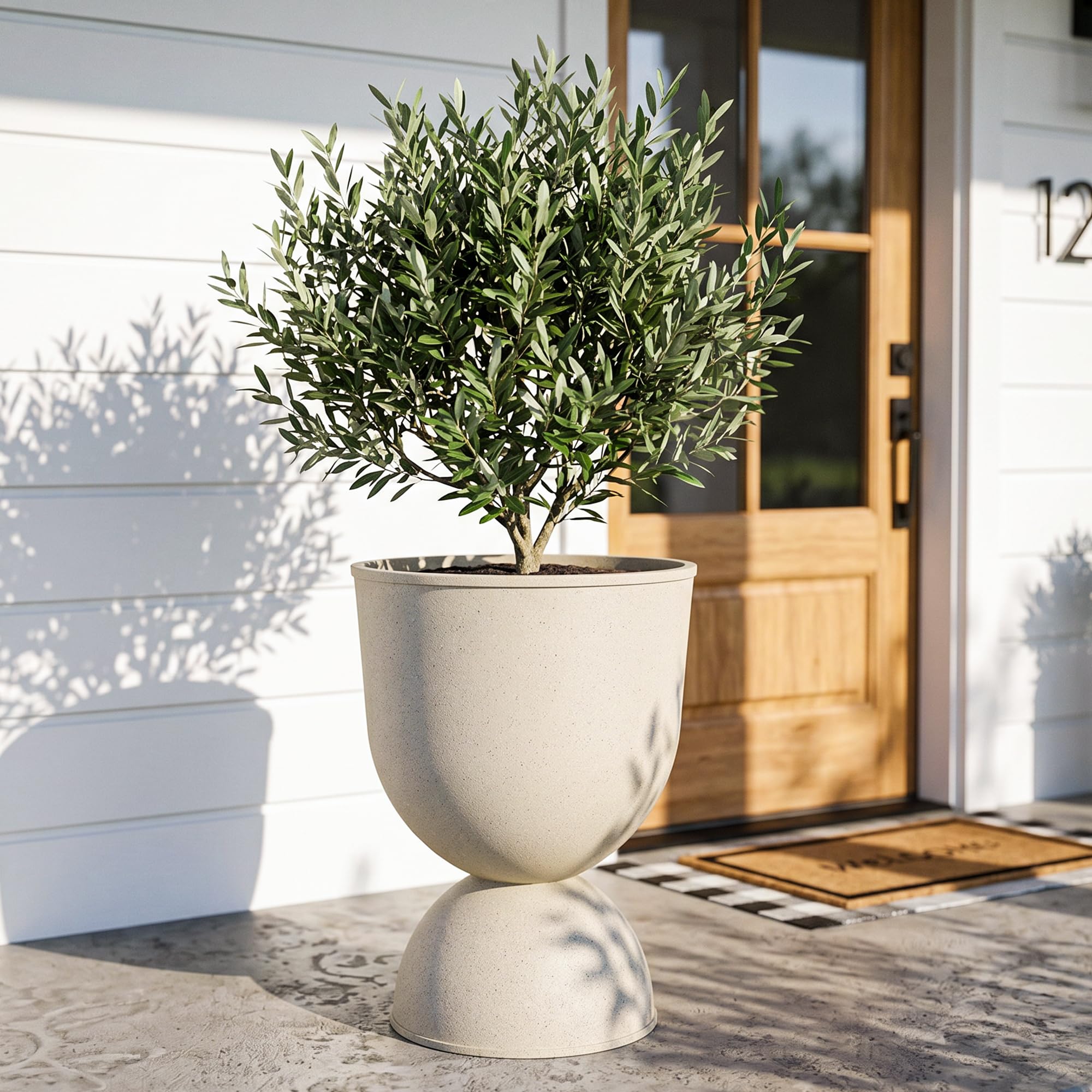 KOL front view of beige pedestal planter showing sculptural urn and curb appeal