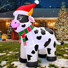 KOOY cow staged on lawn with other decorations offering holiday display inspiration