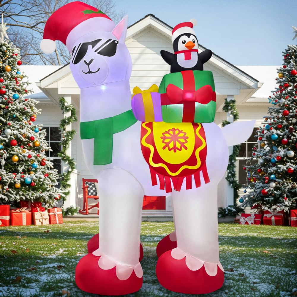 KOOY nighttime yard scene with lit inflatables creating cheerful holiday ambiance