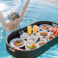 Kordes tray floating in pool with food and drinks, creating relaxed backyard ambience
