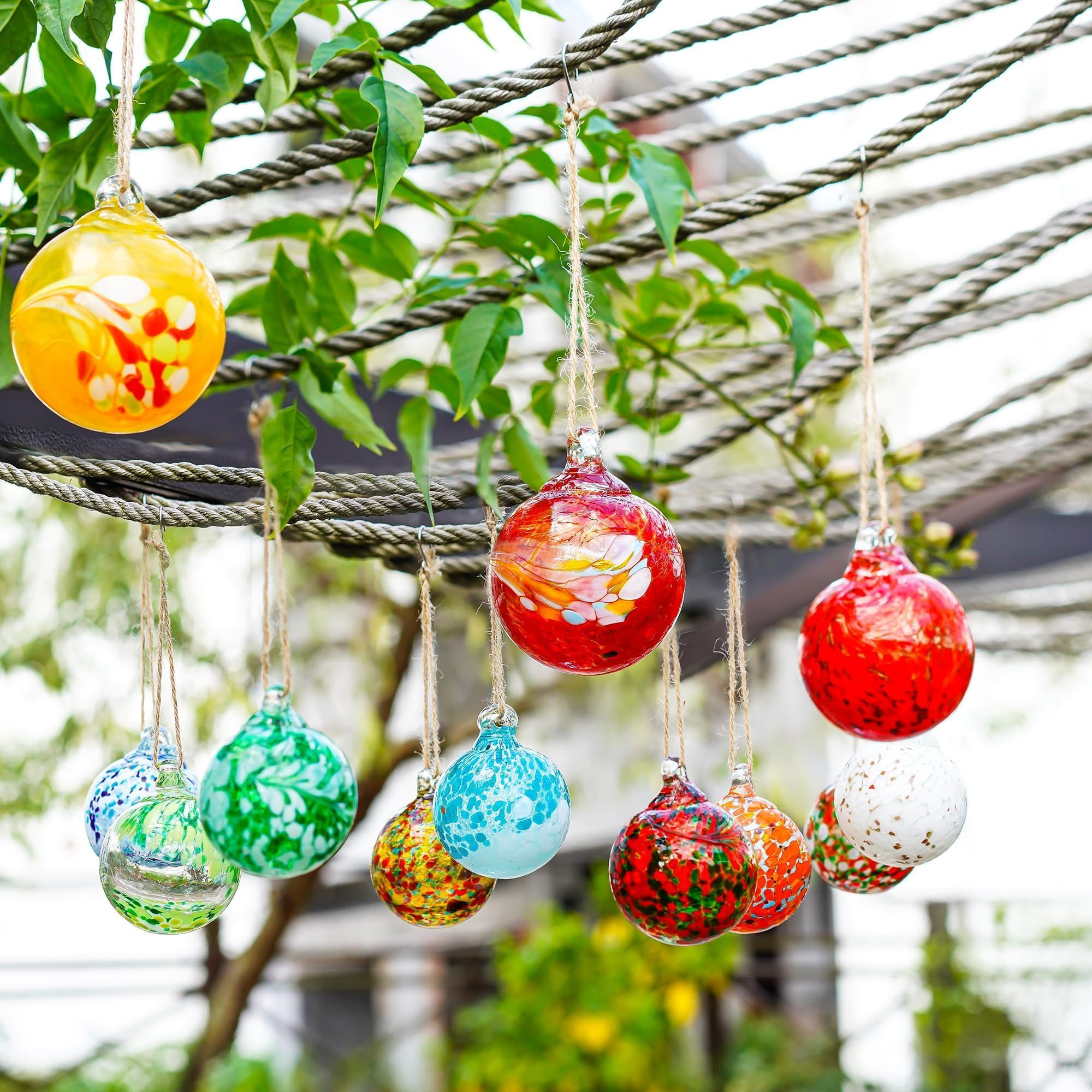 KRISININE gazing balls suspended in a garden gazebo bringing color to outdoor space