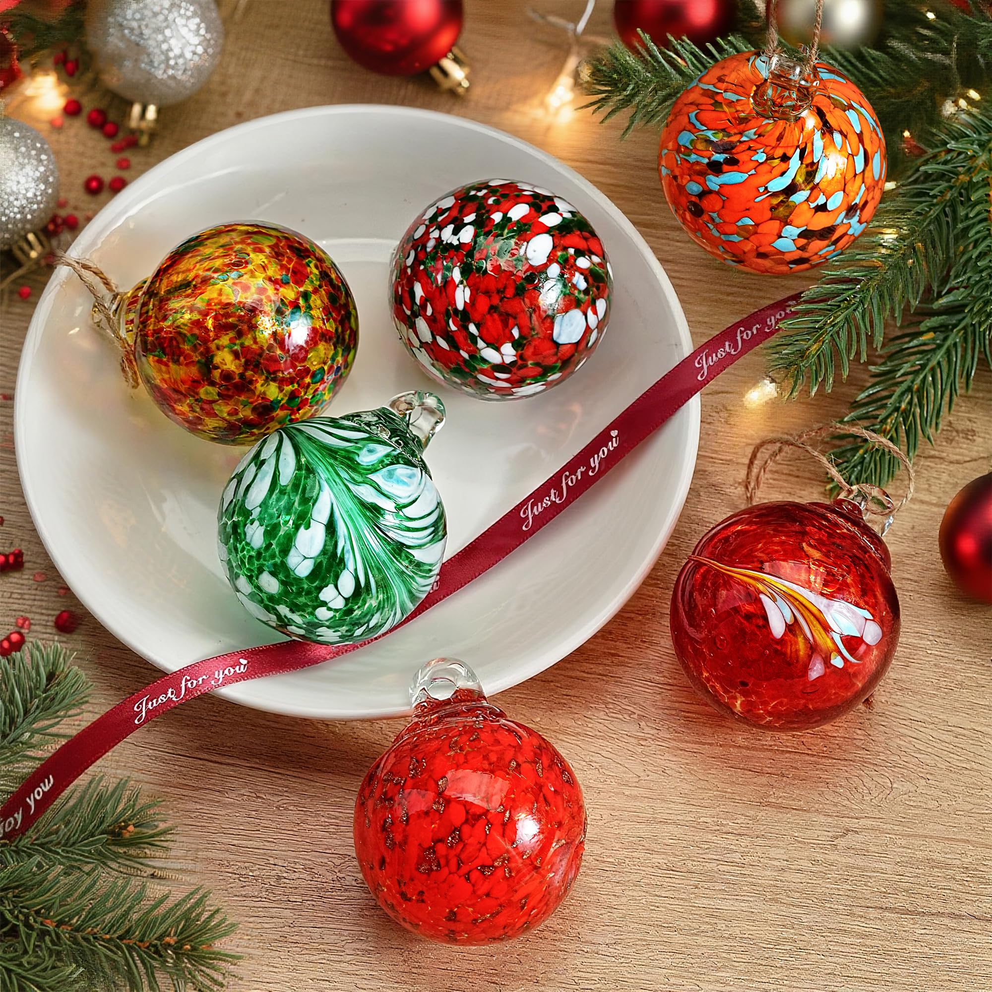 KRISININE glass balls arranged in a bowl forming a modern centerpiece with reflective charm