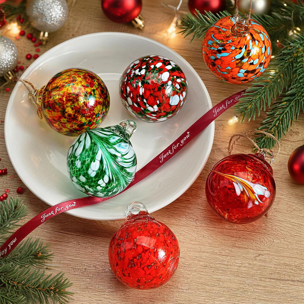 KRISININE glass balls arranged in a bowl forming a modern centerpiece with reflective charm