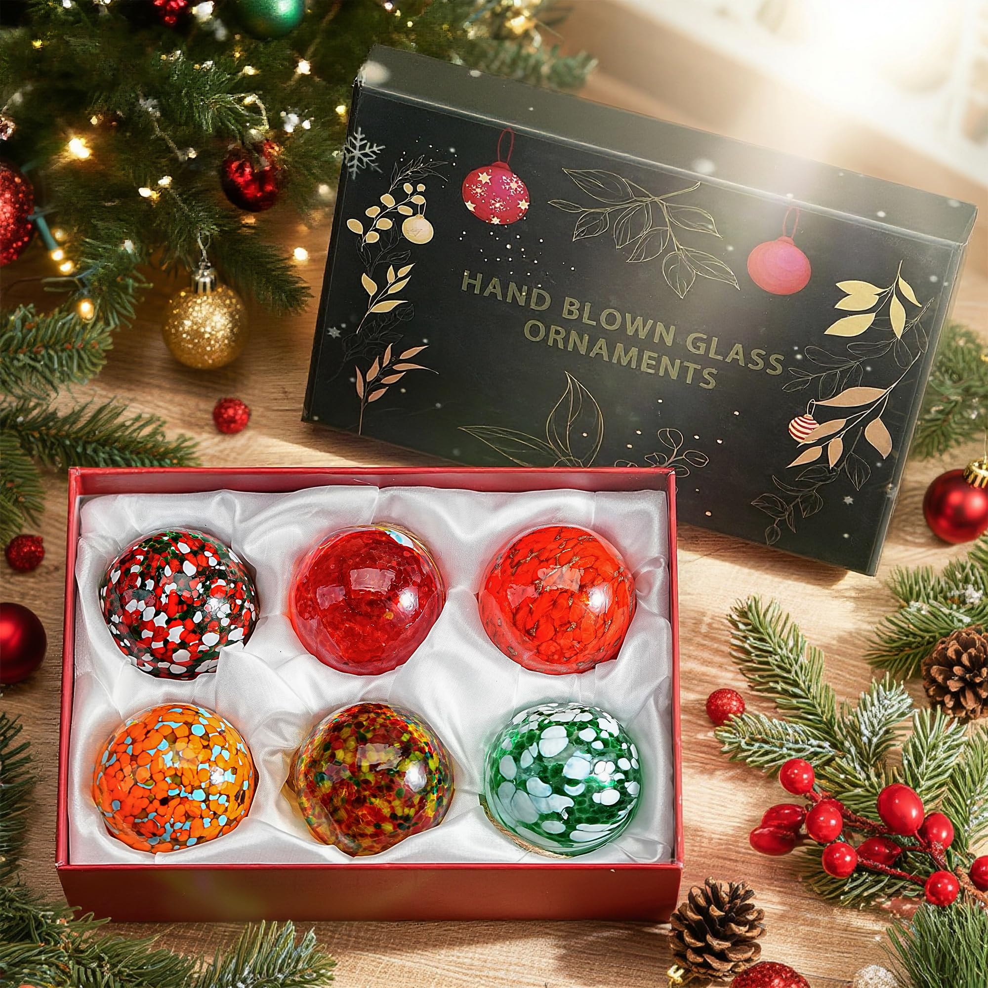 KRISININE ornaments held in hand showing size and sturdy glass feel for accurate scale