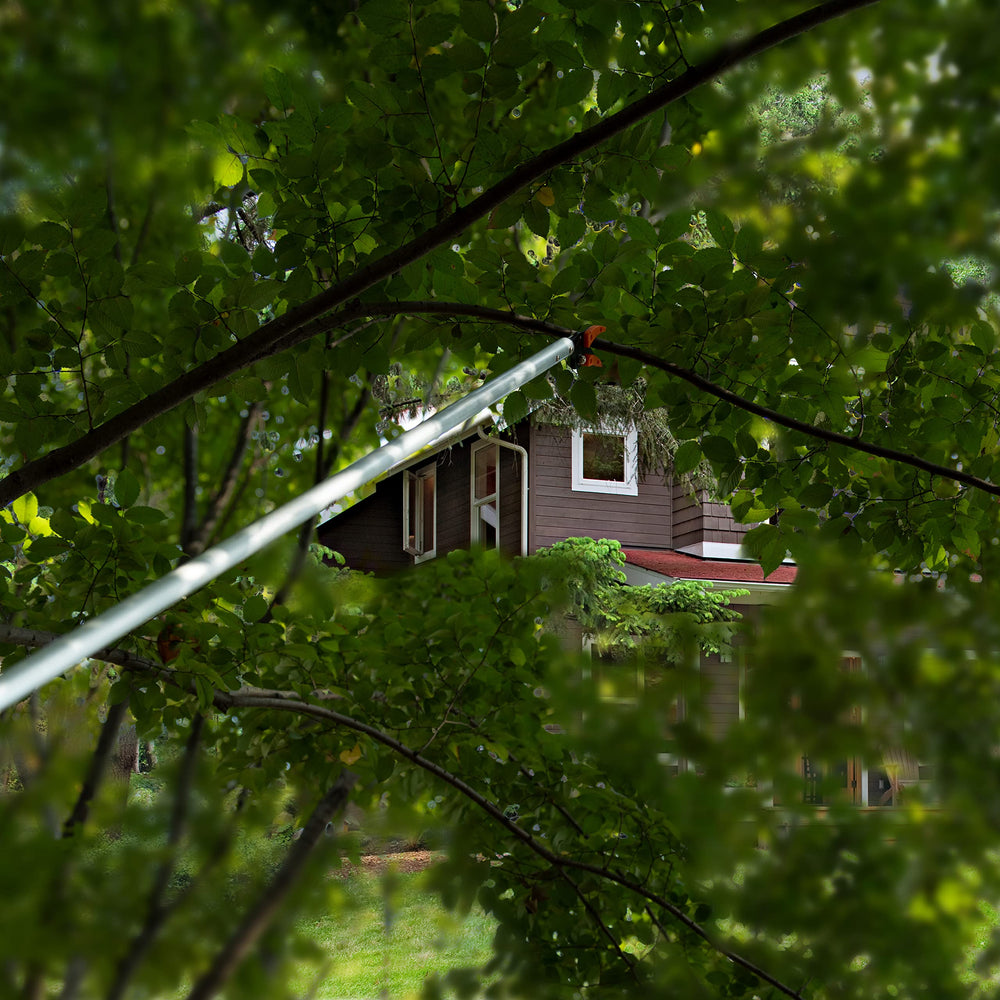 KSEIBI pruner hung on shed hook showing easy storage and space-saving convenience