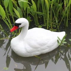 Kuuleyn swan floating on pool to help discourage waterfowl presence
