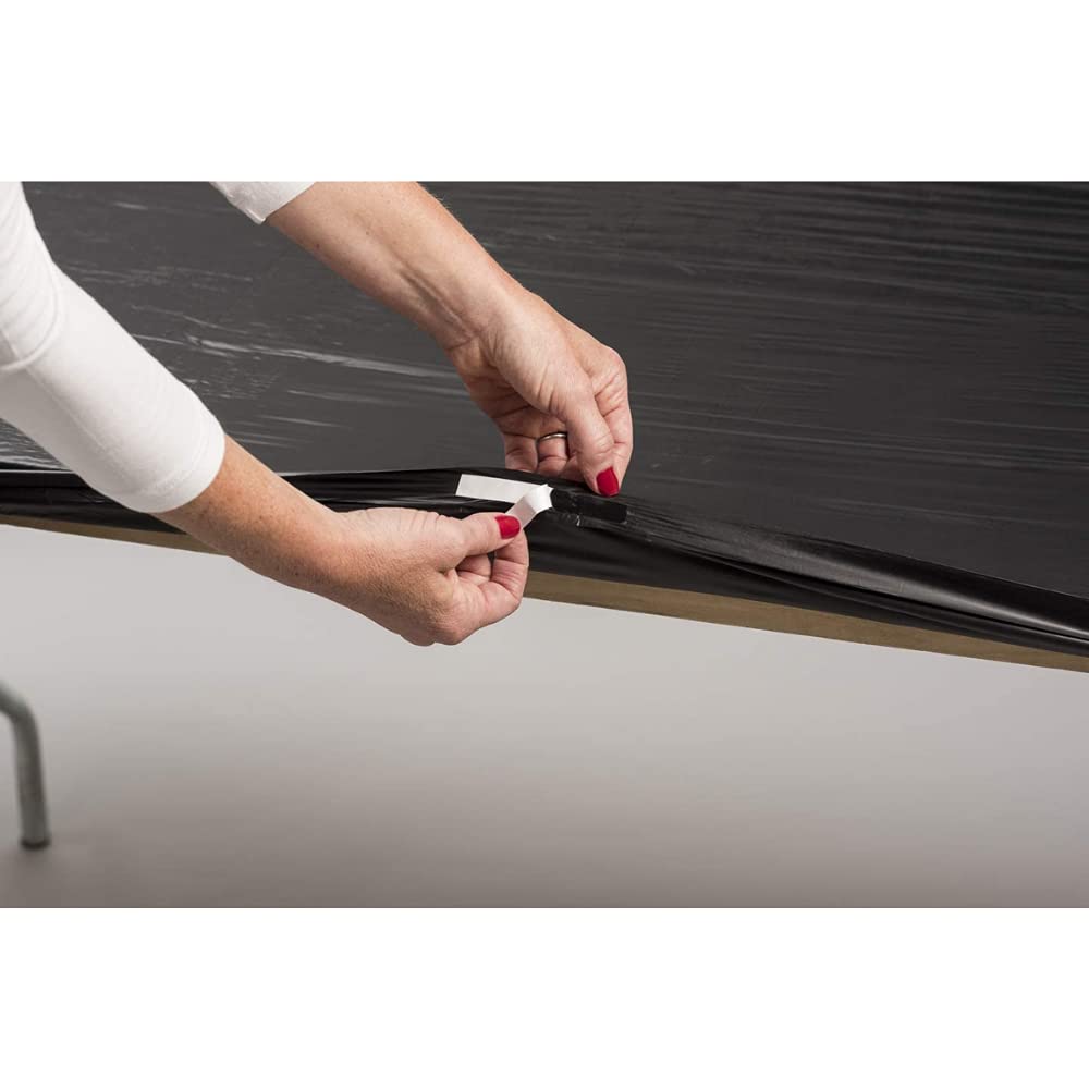 Kwik-Covers next to a ruler and chair to show 60-inch scale and proper table fit