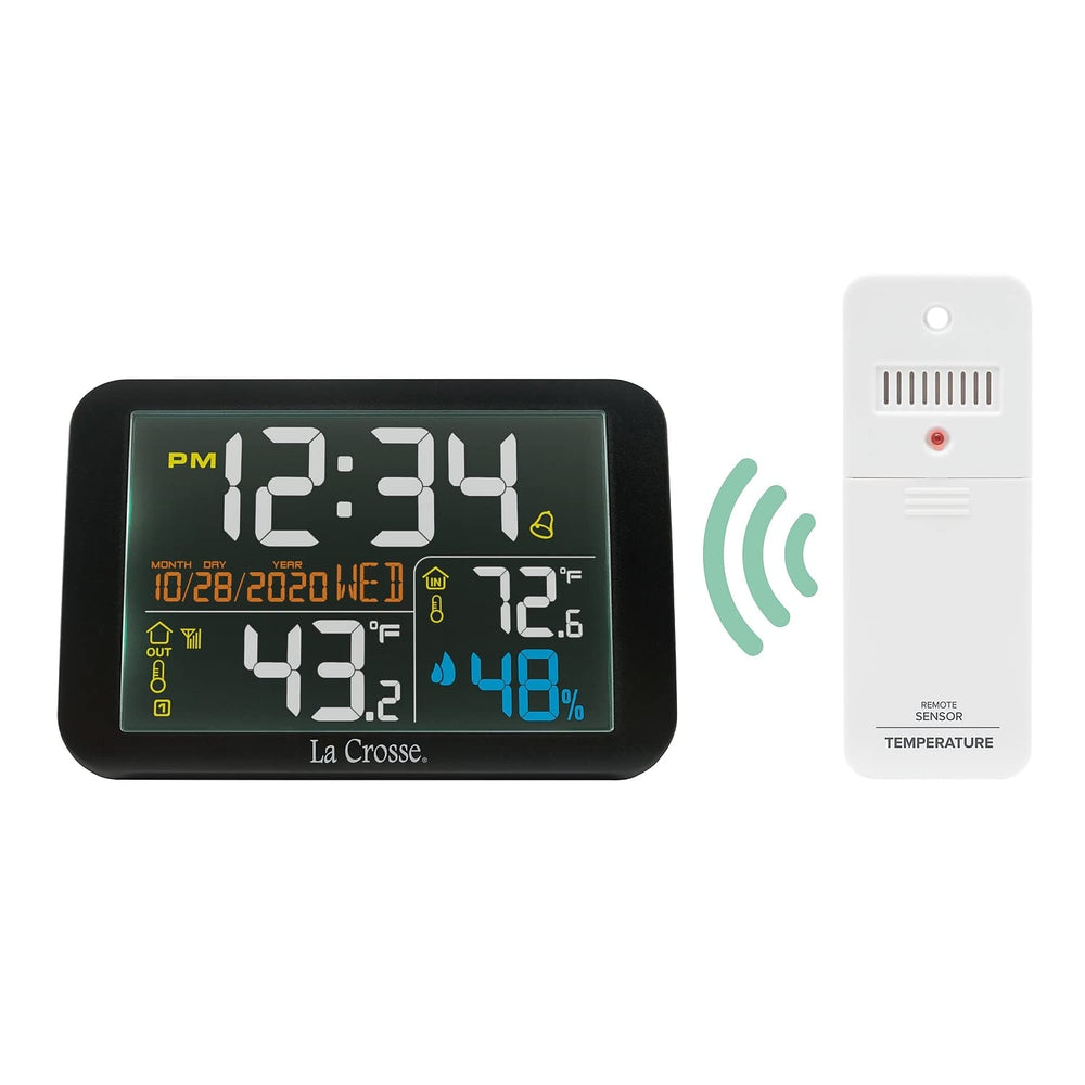 La Crosse Technology on a nightstand with alarm set offering bedside climate visibility