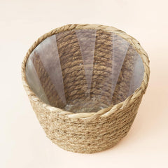 LA JOLIE MUSE baskets styled with potted plants adding natural home warmth