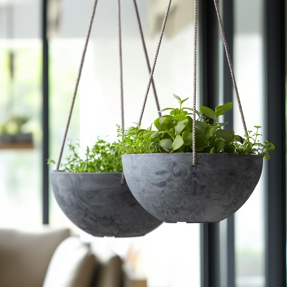 LA JOLIE MUSE planter held in hand for scale to show 9.84-inch diameter and easy installation