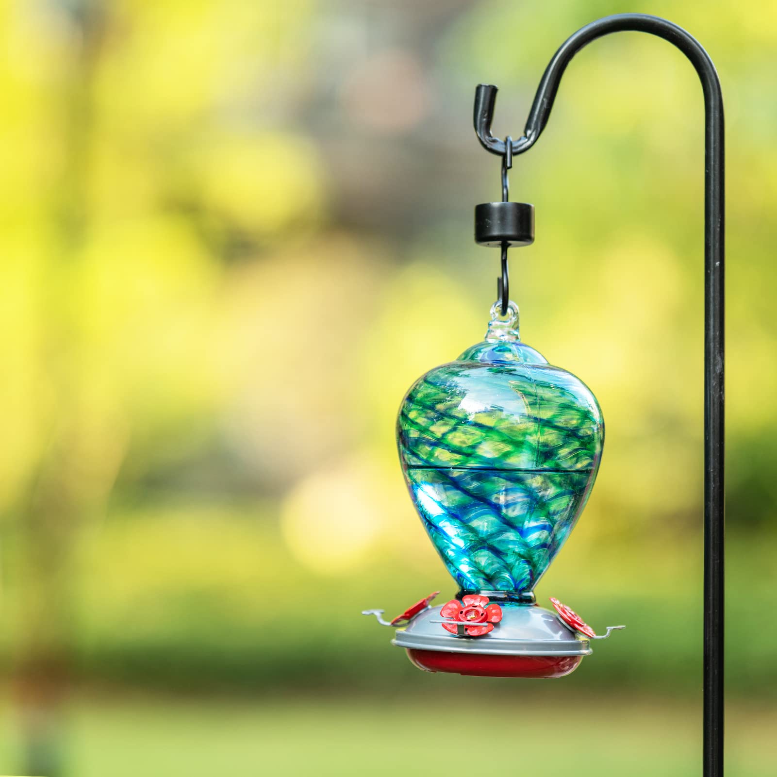 LaElvish Garden feeder beside a water bottle to show 34oz size and fewer refills