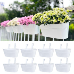 LáLáGreen front view of eight white rail planters, clean balcony styling benefit