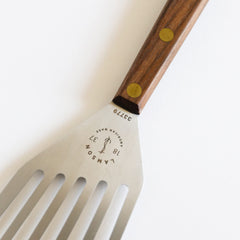Lamson walnut handle detail with brass rivets offering durable grip and long-term stability