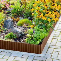 LAVEVE edging installed along flower bed demonstrating clean separation and containment