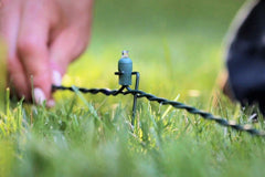 LAWN LIGHTS staked along a driveway showing uniform perimeter illumination benefit