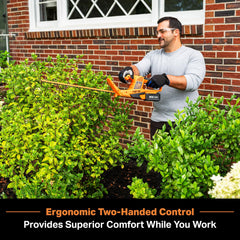 LawnMaster CLHT2422 being used with two-handed grip for comfortable trimming