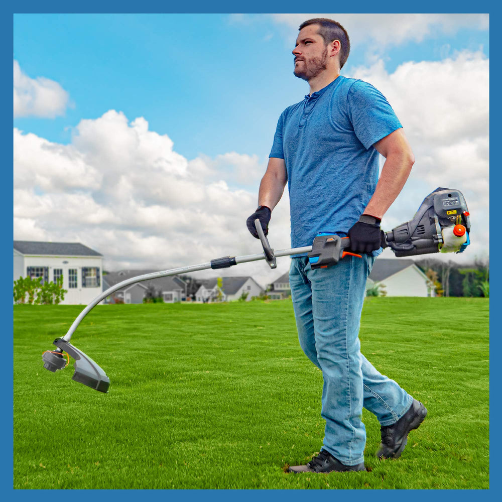 LawnMaster trimming tall grass in yard to show real-world cutting performance
