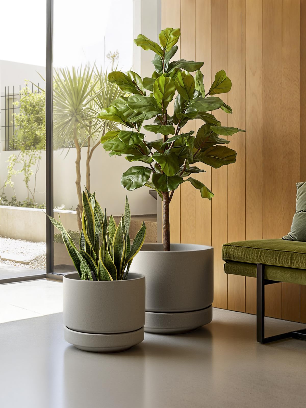 LE TAUCI pot next to large plant showing size and scale for placement