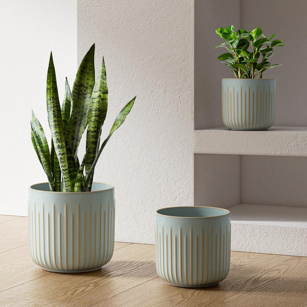 LE TAUCI front view of three mist gray planters showing sizes and finish benefit cohesive styling