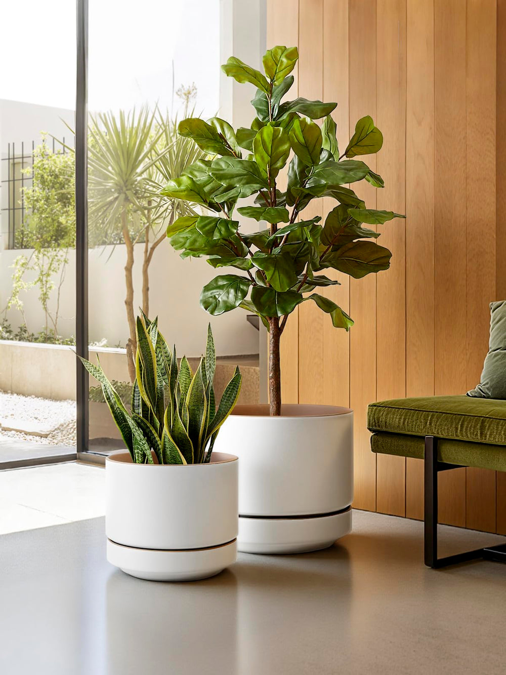 LE TAUCI planter styled with a leafy houseplant in a modern living room setting