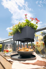 Lechuza bracket mounted on balcony railing illustrating stable planter support