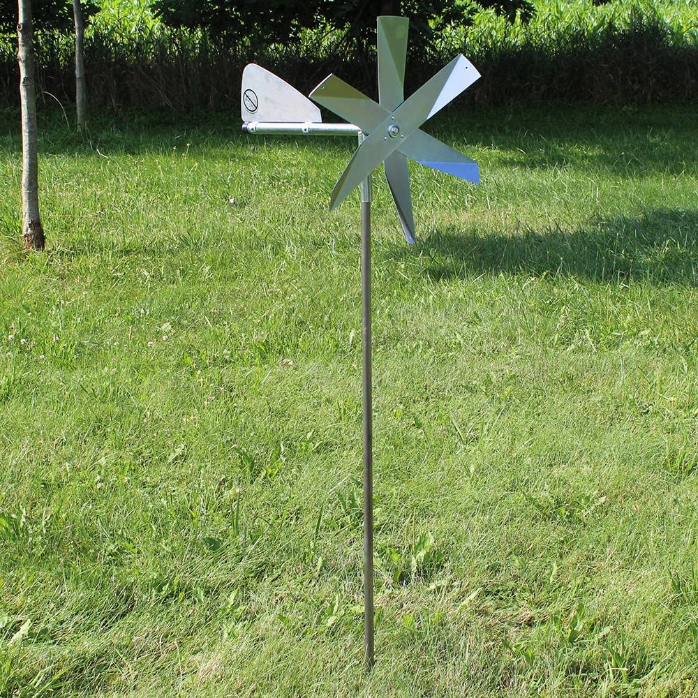 Lehman's windmill next to hand showing scale and easy installation