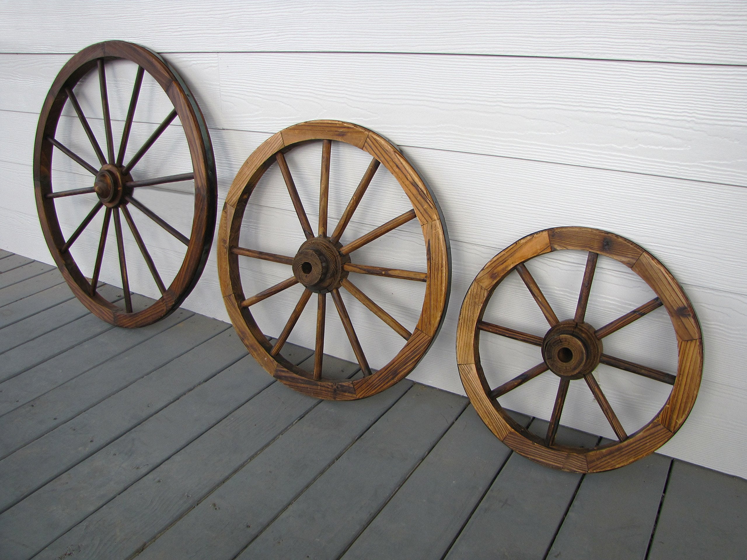 Leigh Country 24-inch wheel mounted on covered porch, creates striking outdoor focal point and atmosphere