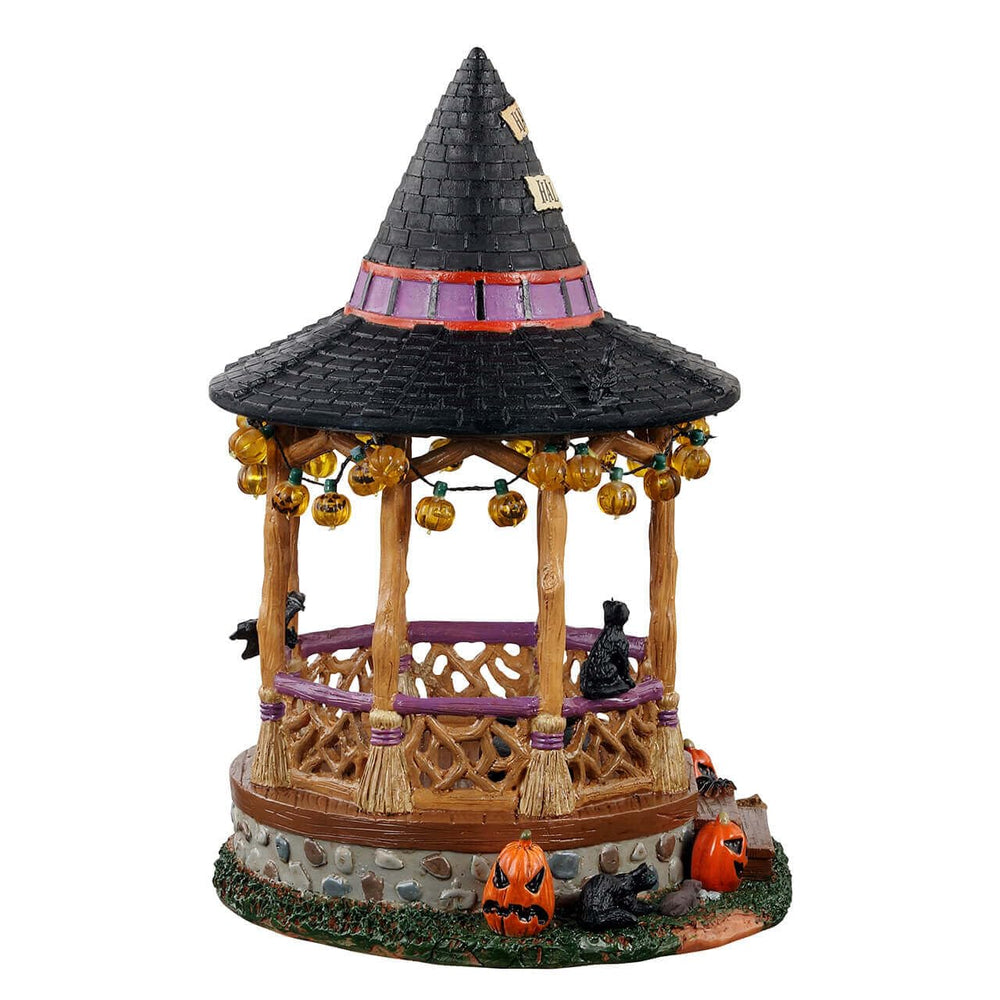 Lemax Witch Gazebo close-up of bubbling cauldron with cat, highlights fine painted detail