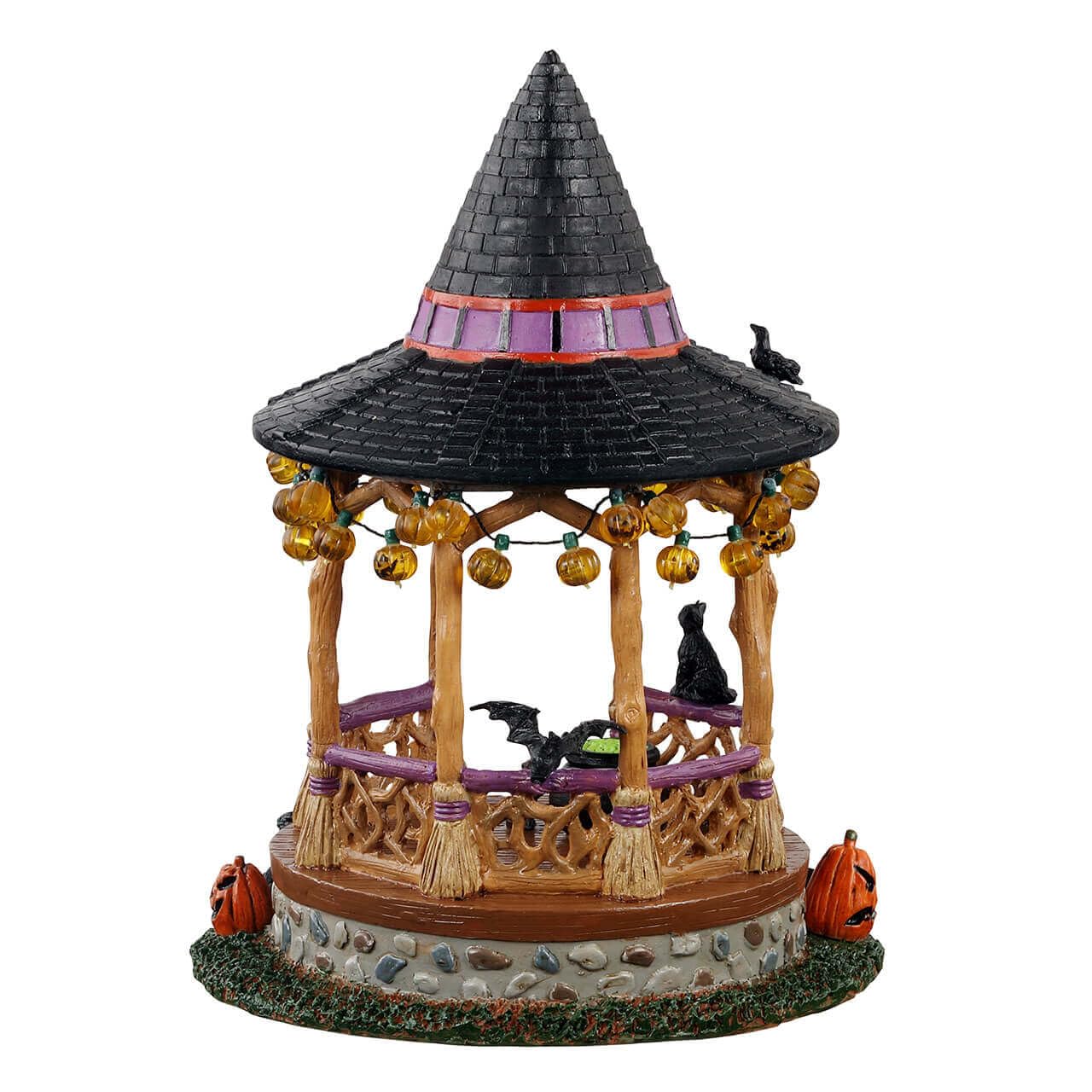 Lemax Witch Gazebo styled in living room vignette, compact spooky decor focal point