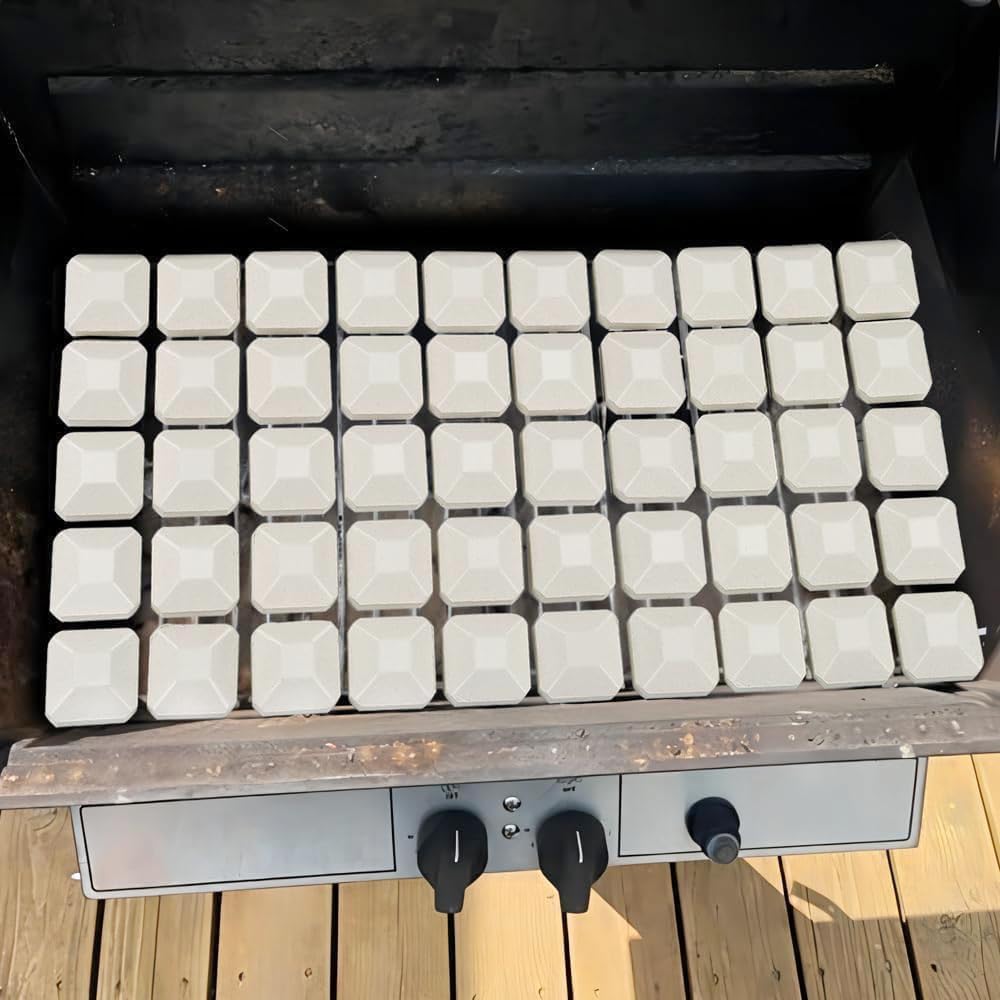 Leship briquettes evenly arranged on a burner tray showing improved heat coverage