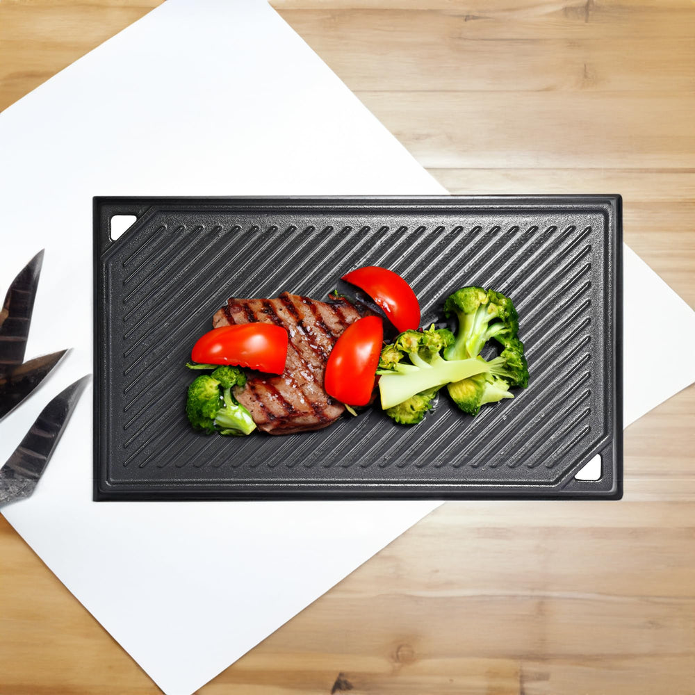 Leship griddle next to utensils showing scale and convenient kitchen fit