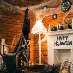 Lewtemi perched crow on mantel creating atmospheric indoor Halloween display