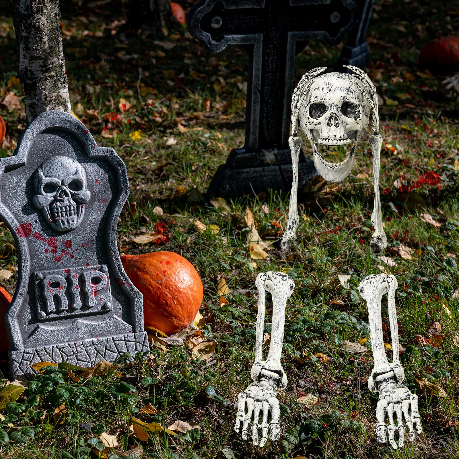 Leyndo skeleton posed in lawn at night adding dramatic Halloween ambiance