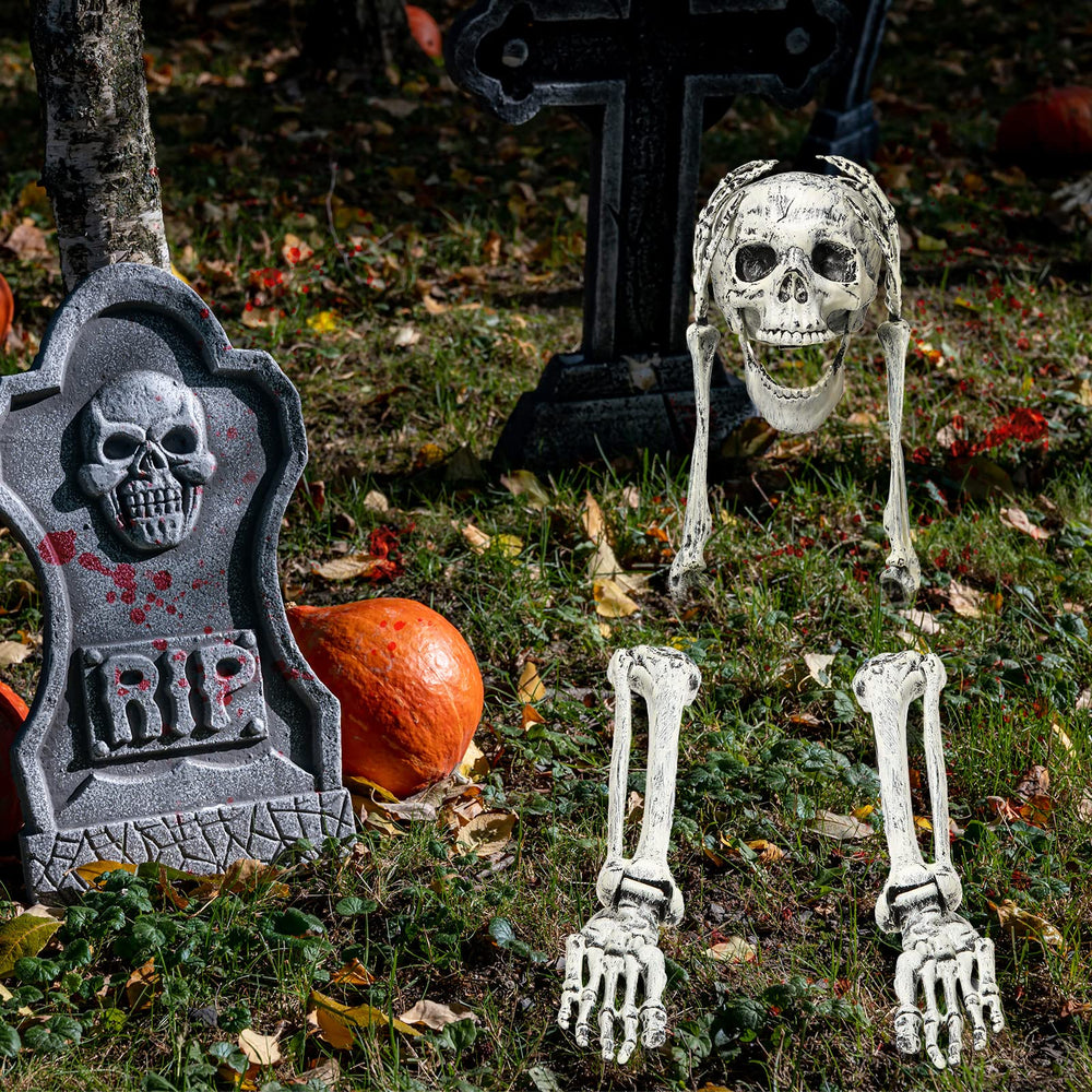 Leyndo skeleton posed in lawn at night adding dramatic Halloween ambiance