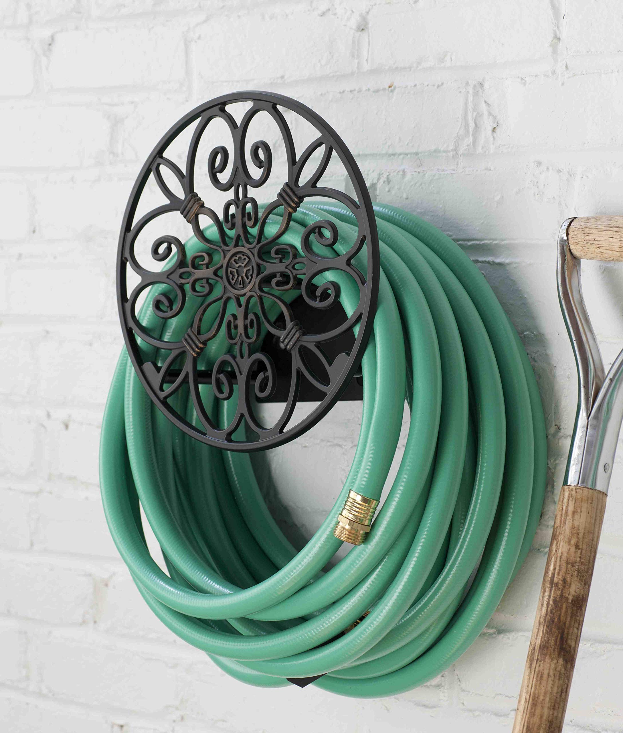 Liberty Garden 670 mounted near spigot with hose coiled demonstrates tidy garden organization