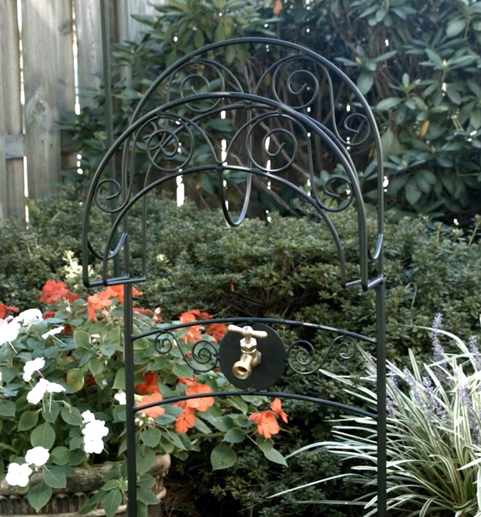 Liberty Garden pointed anchor legs pressed into soil demonstrating secure ground mounting benefit