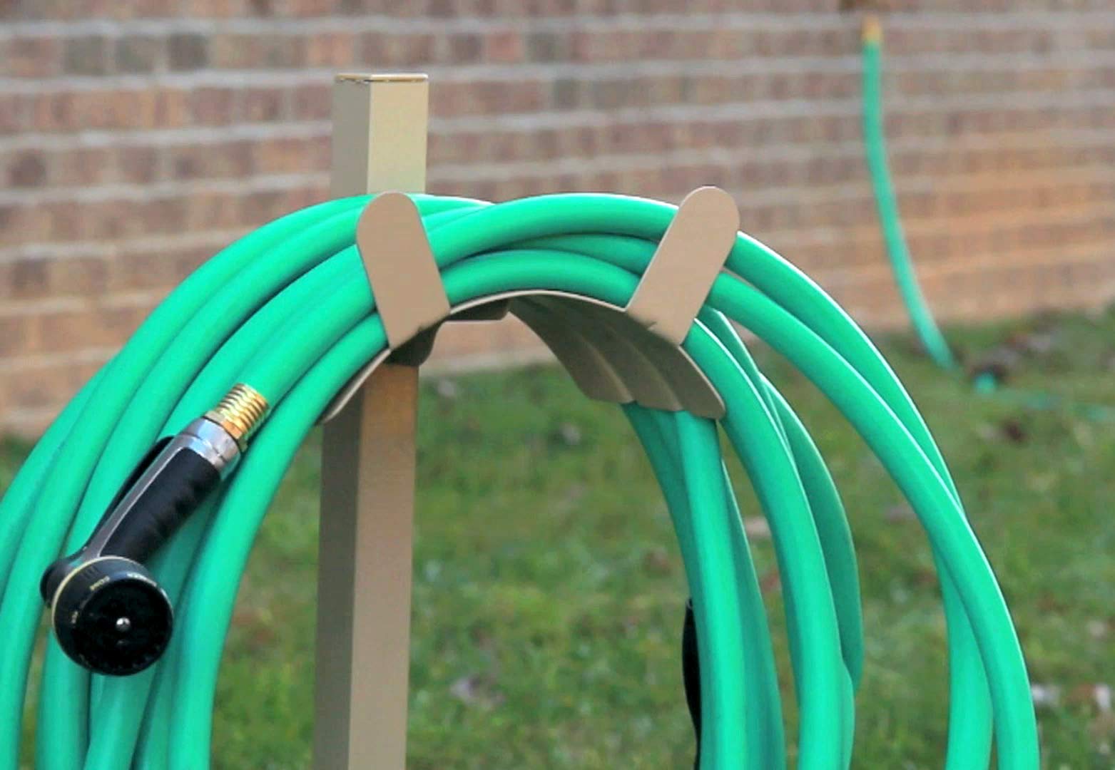 Liberty Garden hose neatly coiled on rack demonstrating tangle-free use benefit
