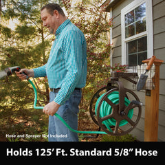Liberty Garden hose reel in use on a garden wall demonstrating easy winding benefit