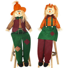 Libima front view of sitting scarecrows showing friendly fall welcome