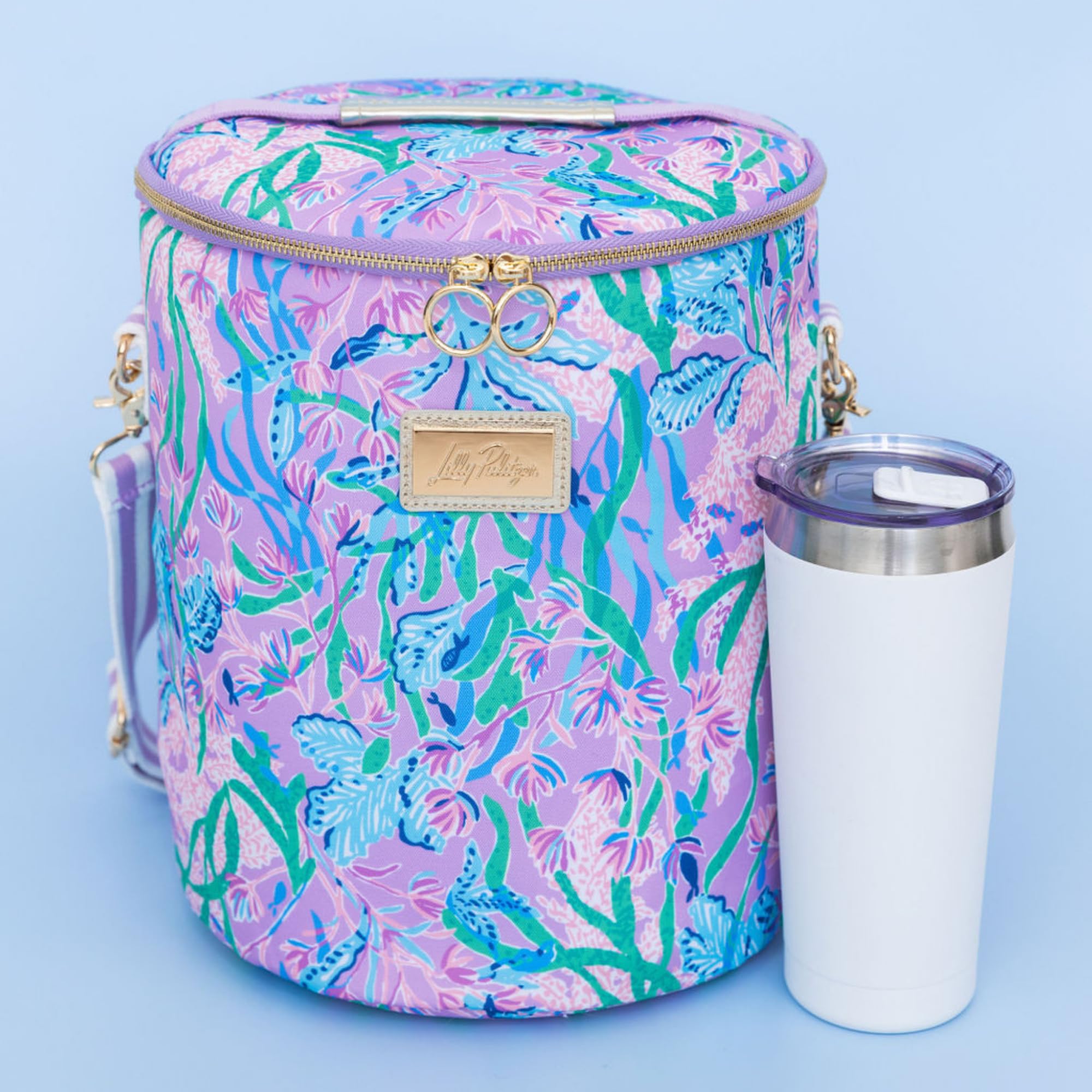 Lilly Pulitzer next to water bottle showing scale and tall capacity for bottles and snacks