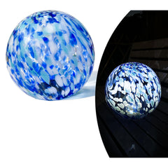 Lily's Home front view of blue glass gazing ball showing vibrant color and curb appeal
