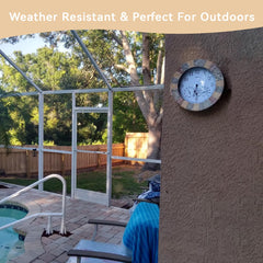 Lily's Home clock hung on patio wall adding style and outdoor functionality