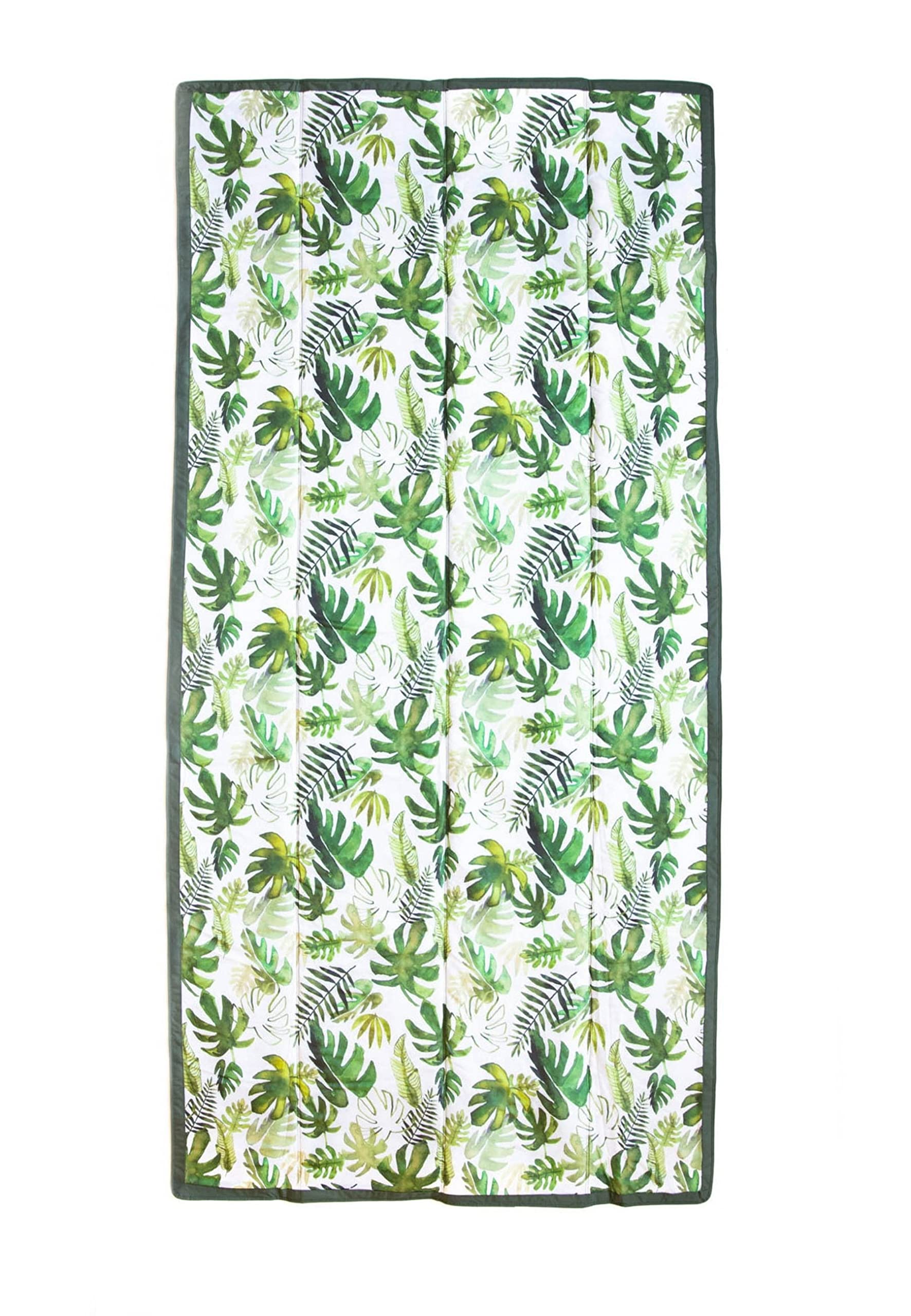 Little Unicorn front packaged blanket showing tropical leaf pattern and compact fold benefit