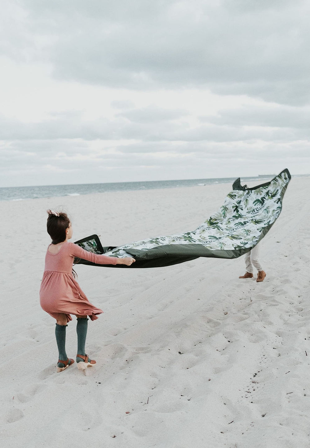 Little Unicorn fully spread 5x10 blanket displaying roomy family seating area benefit