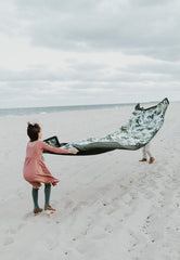Little Unicorn fully spread 5x10 blanket displaying roomy family seating area benefit