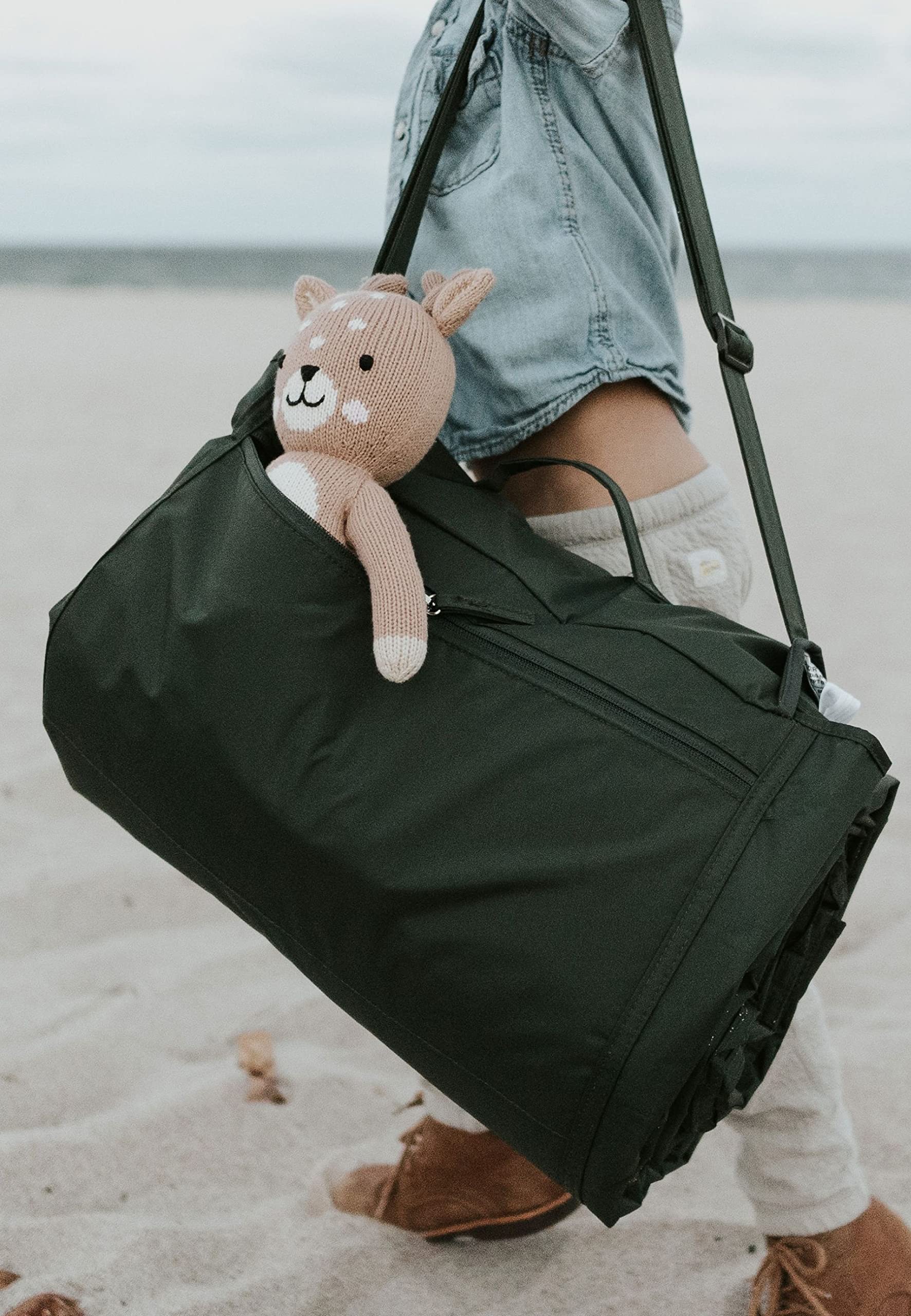 Little Unicorn exterior zipper pocket detail showing secure storage for keys and phone