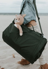 Little Unicorn exterior zipper pocket detail showing secure storage for keys and phone