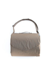 Little Unicorn exterior zipper pocket detail securing essentials on outings